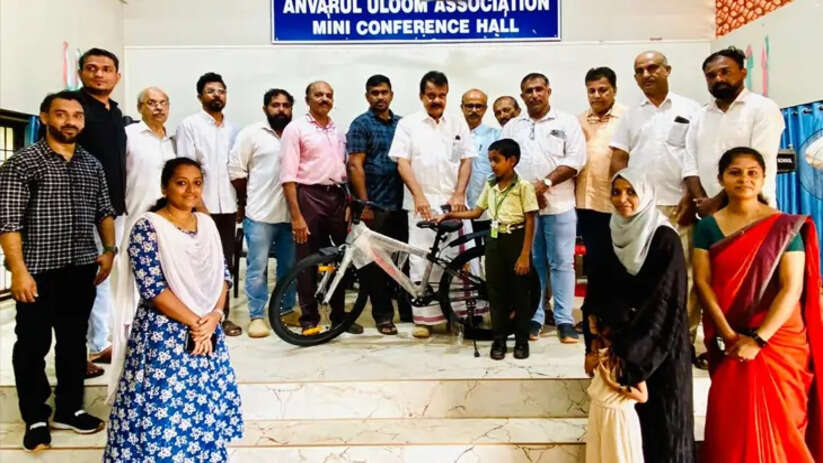 A young boy receiving a new bicycle as a reward for his charity.