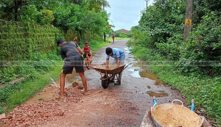 villagers repair neglected road in paivalike