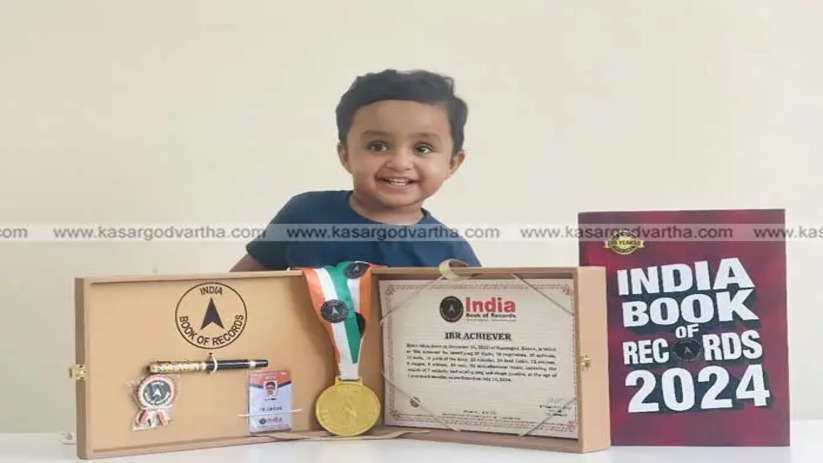 A young boy holding a certificate