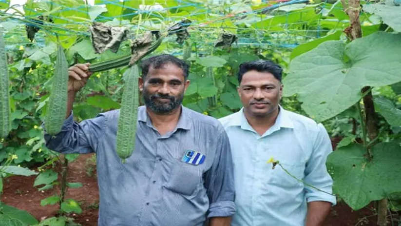 Brothers celebrating their organic farming success in Ravanaswaram