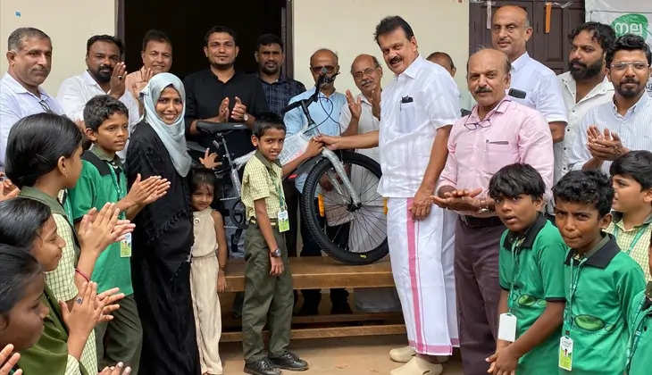 A young boy receiving a new bicycle as a reward for his charity.